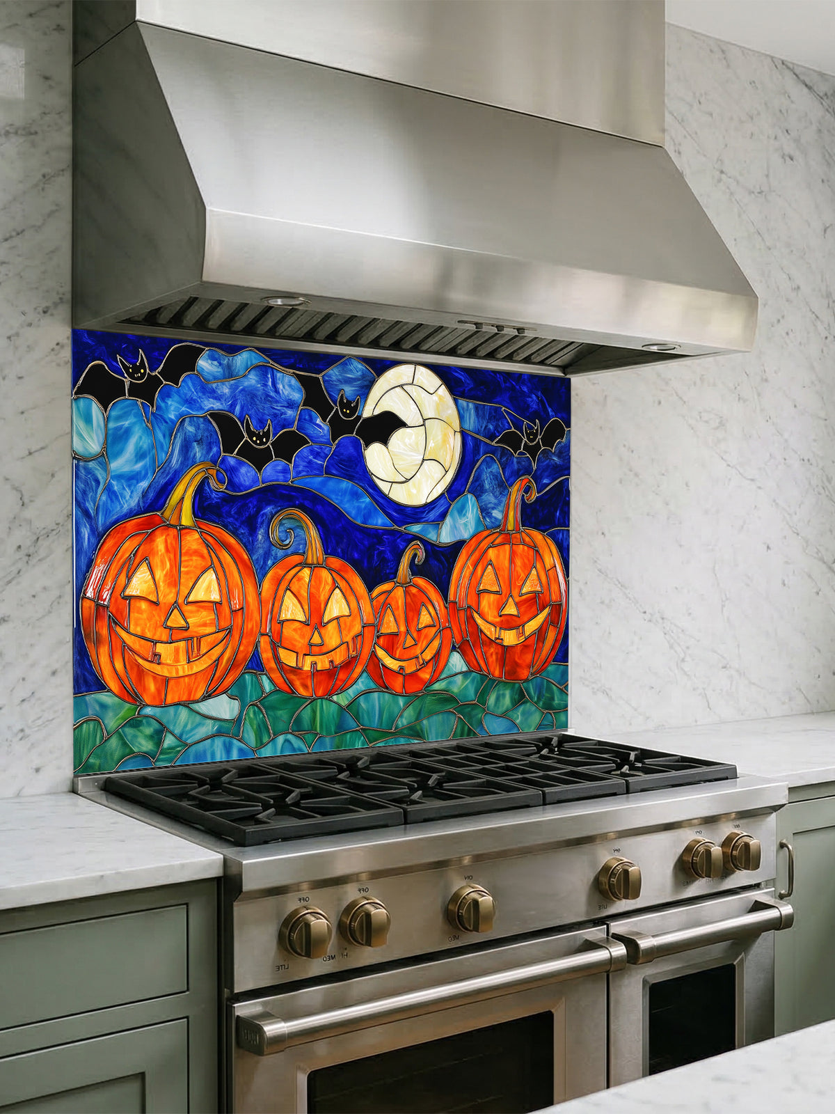 Kitchen stove with a decorative Halloween-themed backsplash featuring pumpkins and bats.