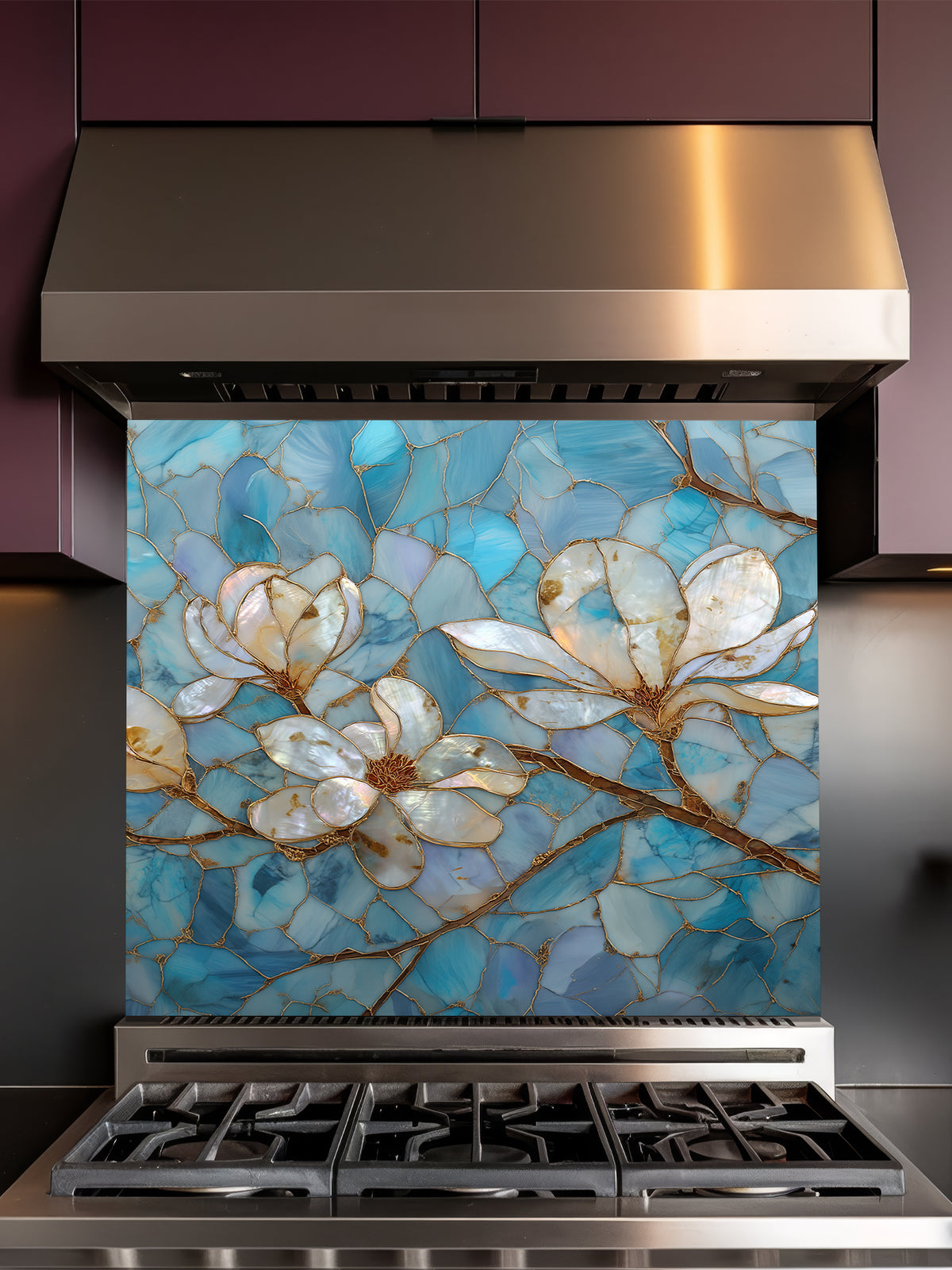 Stained glass style white magnolia flowers with gold veining on a beautiful cracked blue agate background, UV printed on a smooth tempered glass kitchen backsplash, installed behind a modern stove.