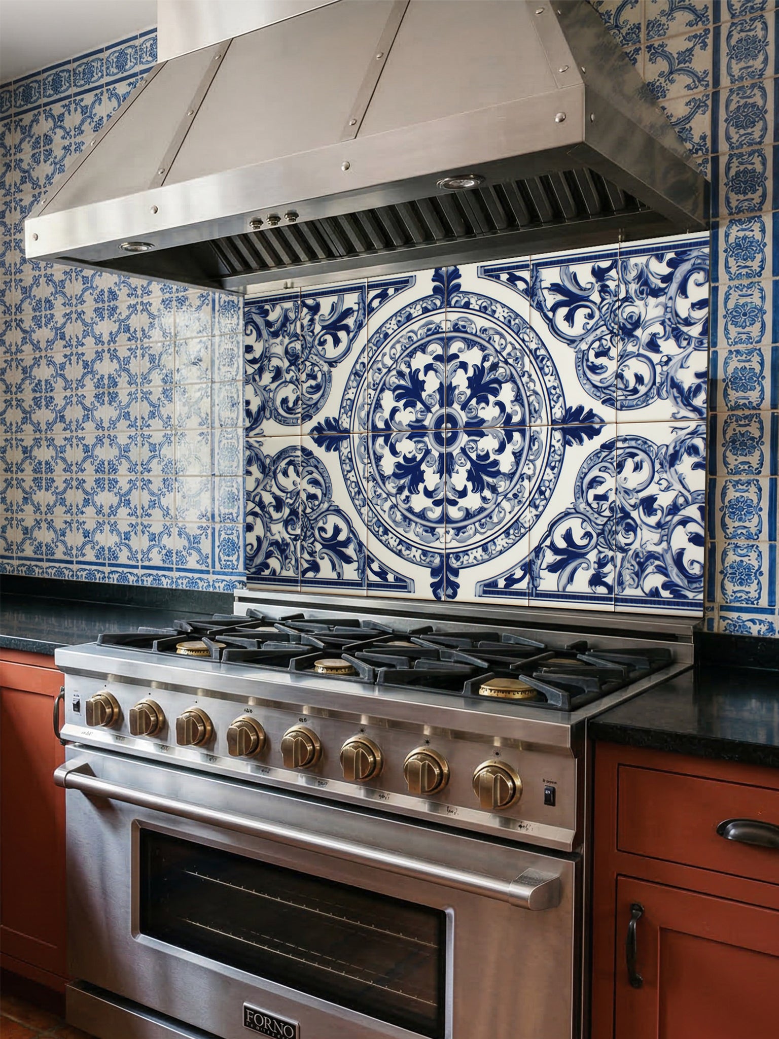 Tempered glass kitchen backsplash featuring a traditional Mediterranean blue and white Azulejo faux tile design with an ornate central floral mandala pattern, installed behind a modern stainless steel stove.