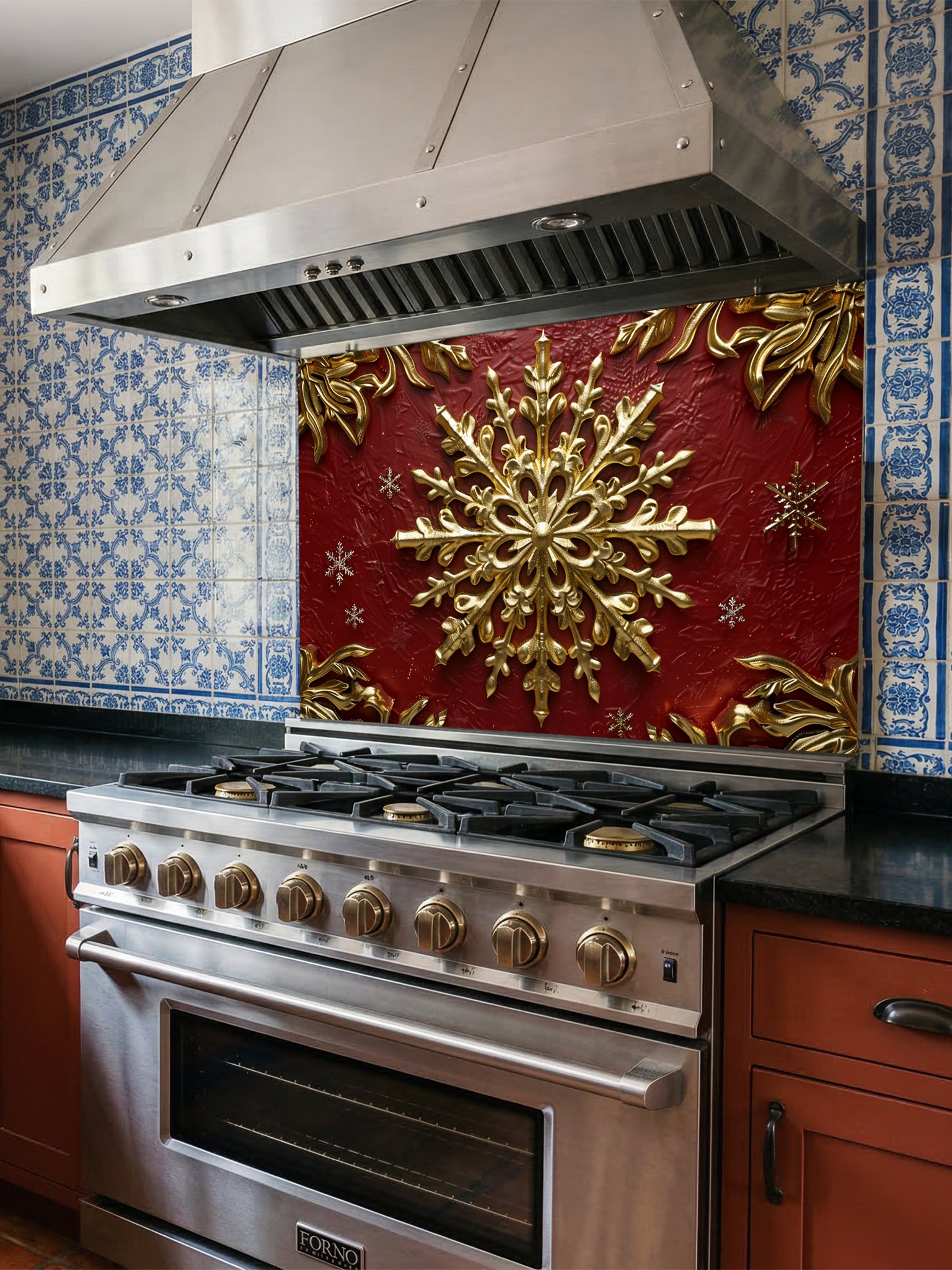 Tempered glass kitchen backsplash featuring a highly realistic 3D illusion of an ornate, embossed gold snowflake surrounded by smaller snowflakes and elegant golden corner flourishes against a rich, textured burgundy red background, installed behind a modern black stove.