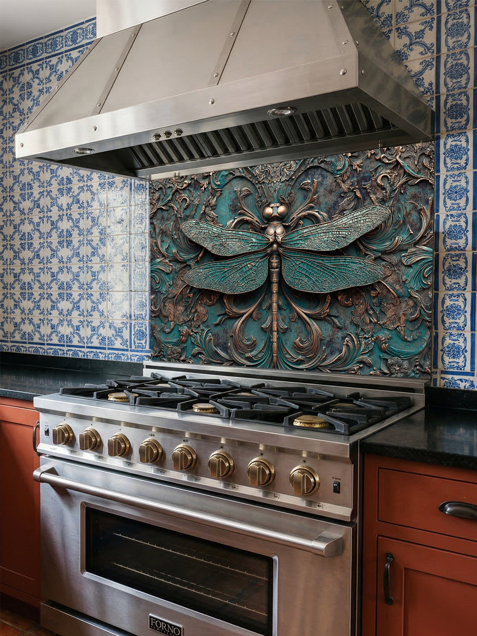 Tempered glass kitchen backsplash featuring a highly realistic 3D faux metal relief design of a detailed dragonfly and ornate antique bronze baroque scrollwork over a textured oxidized teal background, installed behind a modern stainless steel stove.