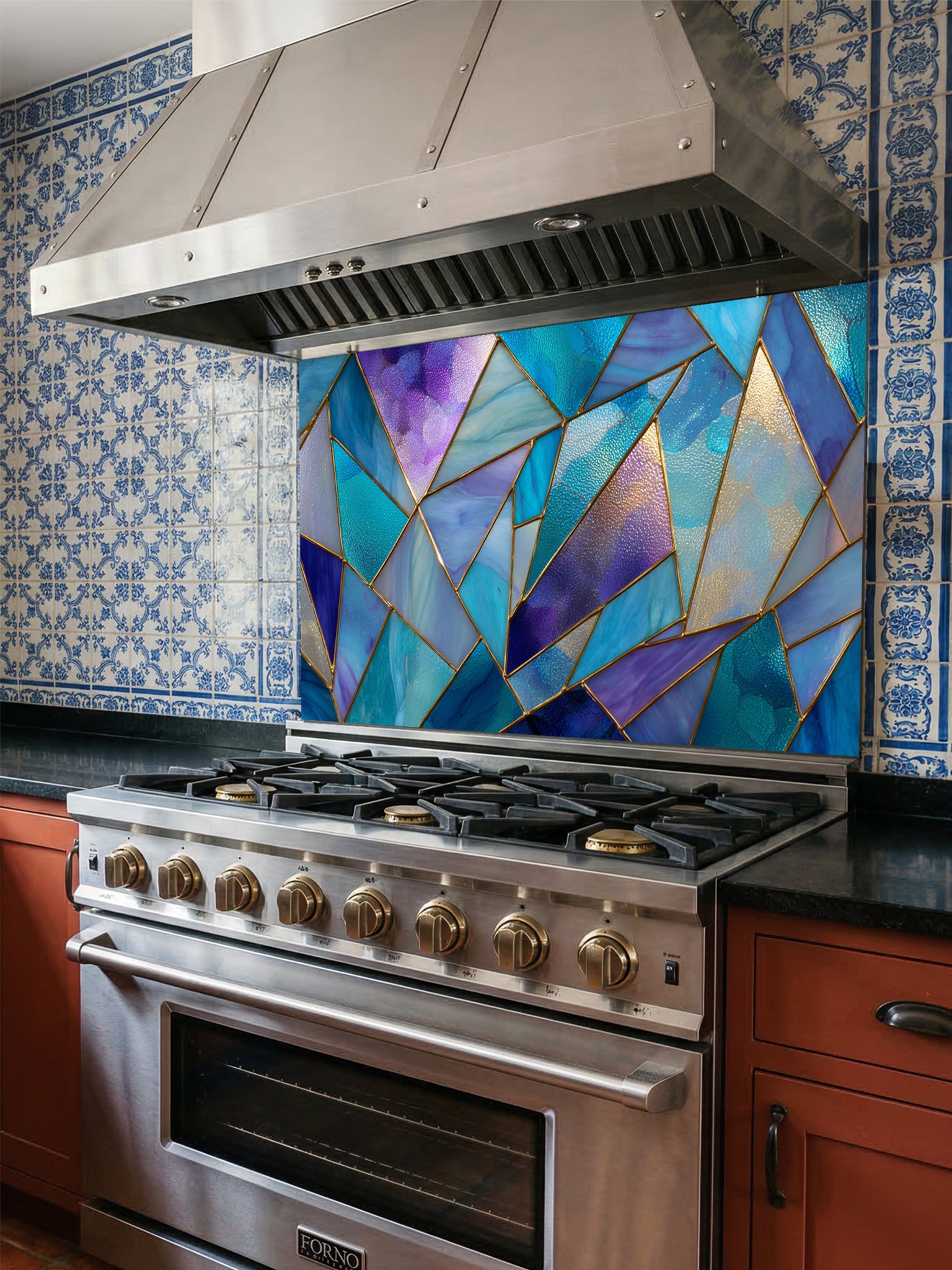 Tempered glass kitchen backsplash featuring a vibrant geometric stained glass effect with blue, teal, and purple shards separated by gold lines, installed behind a modern stainless steel stove.