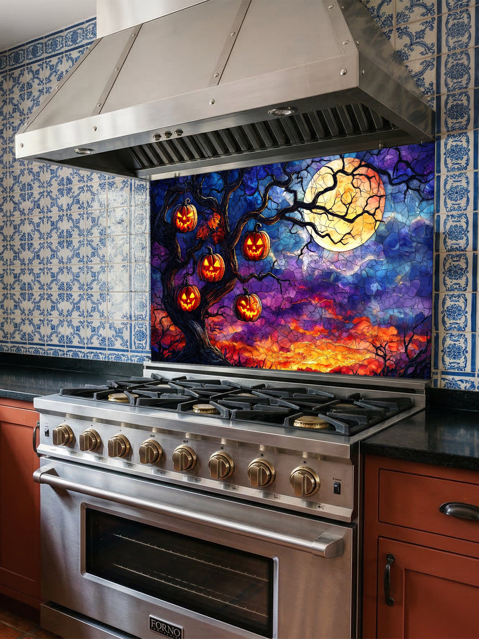 Stainless steel oven with a colorful Halloween-themed backsplash featuring pumpkins and a full moon.