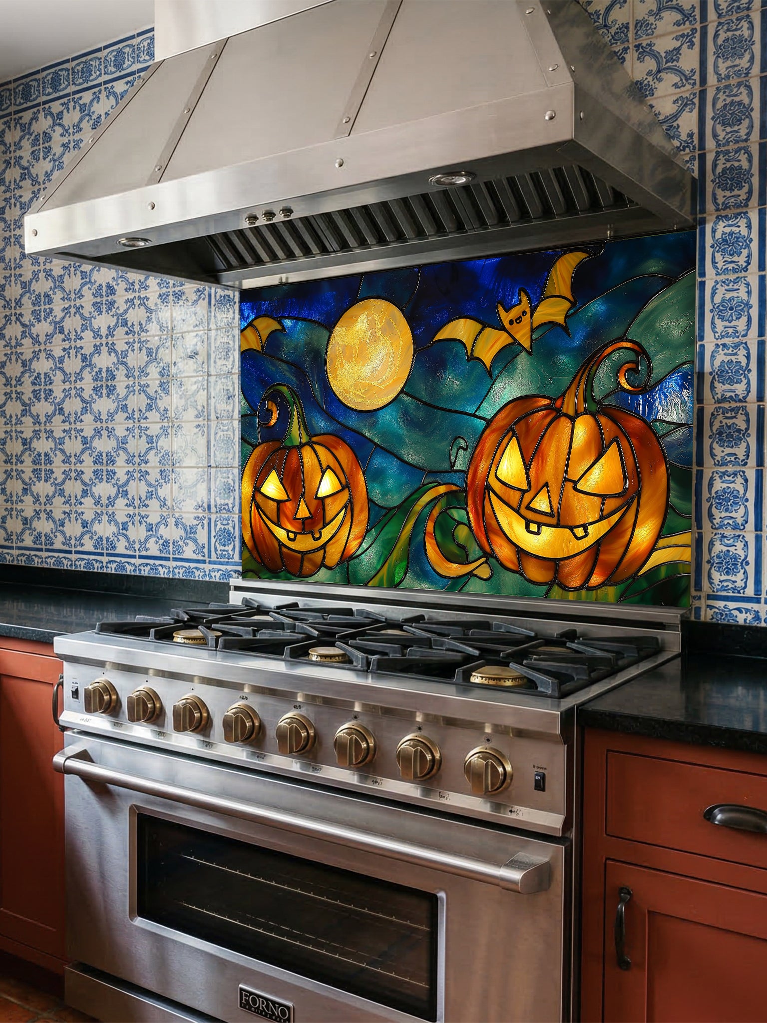 Stainless steel oven with decorative Halloween-themed glass backsplash above it in a kitchen.