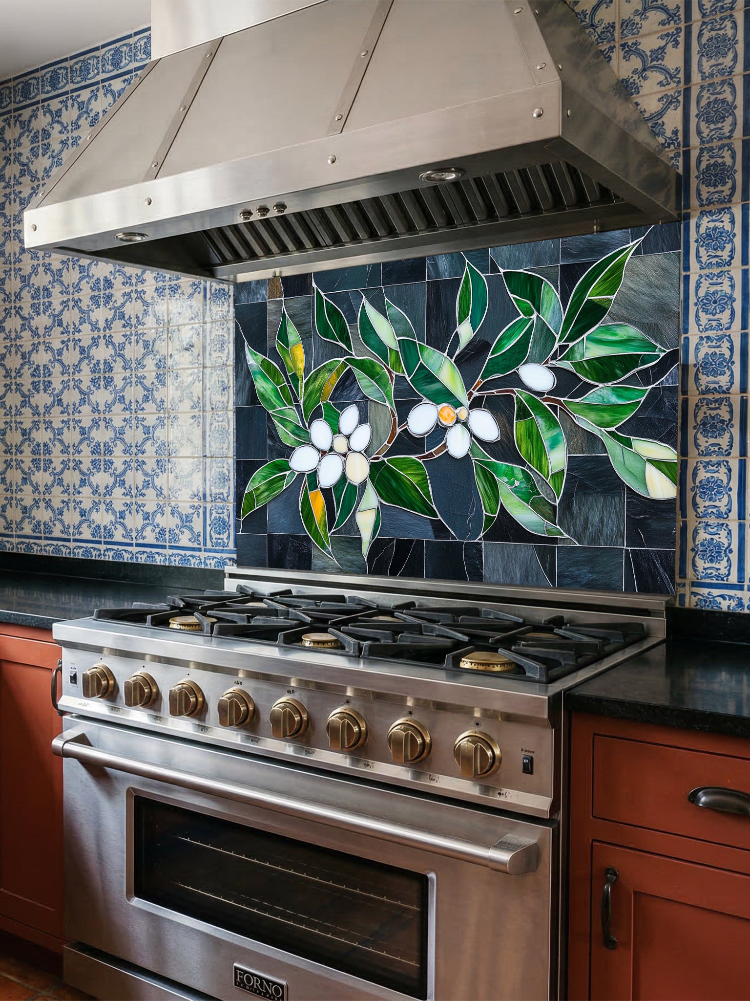 Tempered glass kitchen backsplash featuring a highly realistic 3D illusion of stained glass white blossoms and emerald green leaves integrated into a background of dark charcoal grey textured slate tiles, installed behind a modern black stove.