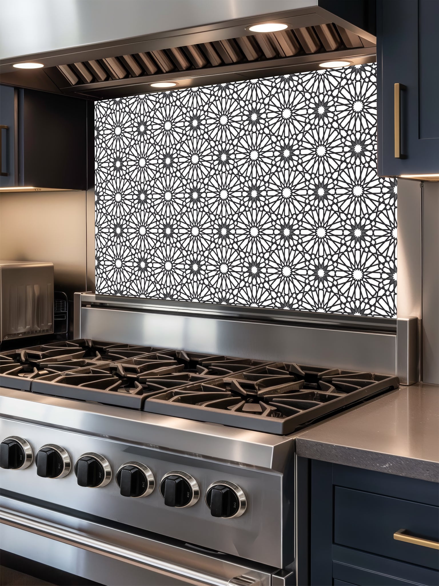 Stainless steel stove with decorative backsplash in a kitchen setting
