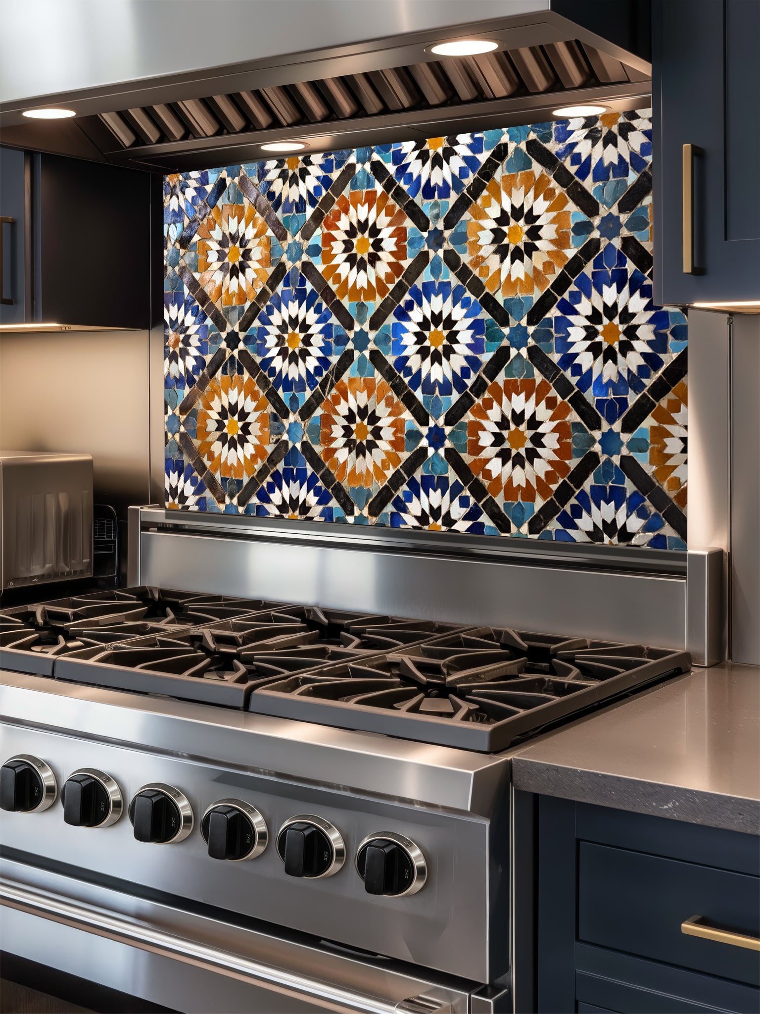 Stainless steel stove with decorative mosaic tile backsplash in a kitchen setting