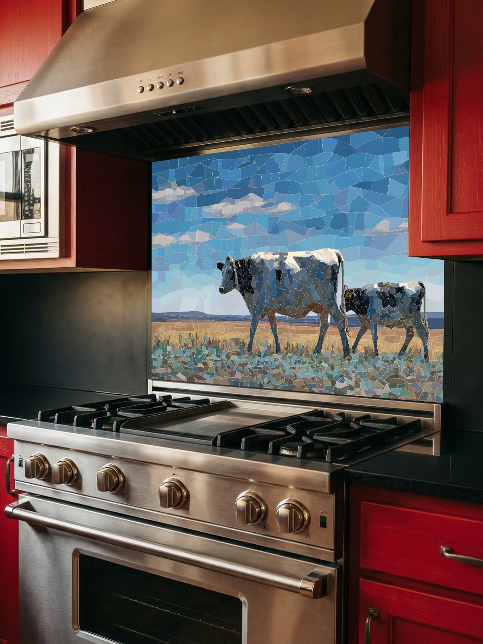 Faux mosaic tile art of a cow and calf in a pasture under a blue sky, UV printed on a smooth tempered glass kitchen backsplash, installed behind a modern stove.