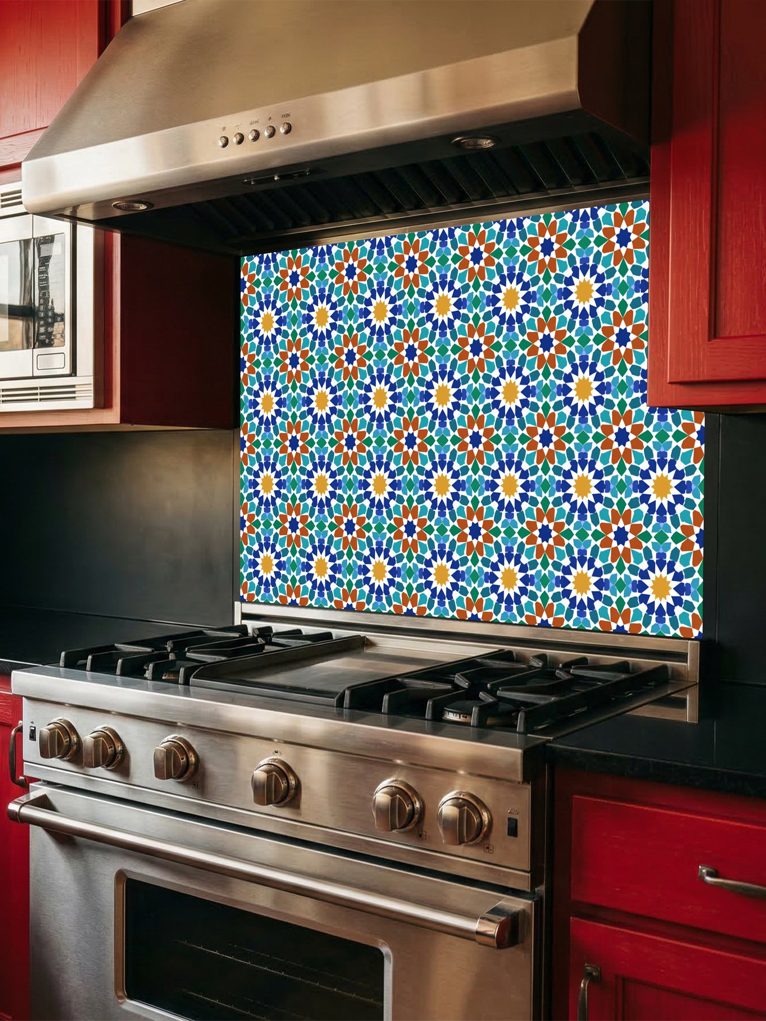 Stainless steel oven with colorful geometric patterned backsplash in a kitchen setting.