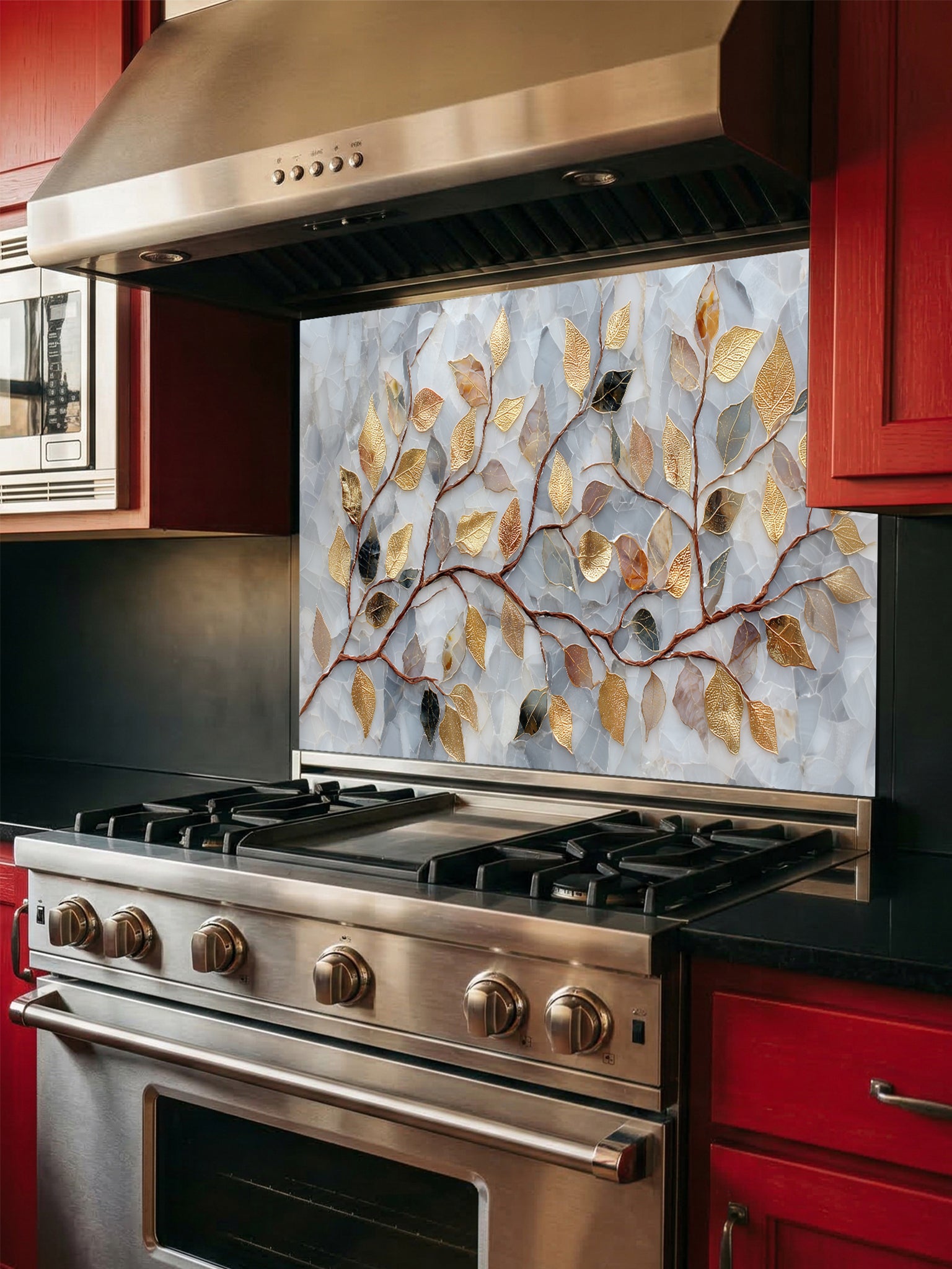 Tempered glass kitchen backsplash featuring a realistic 3D-effect design of elegant gold and bronze leaves on curving branches over a pearlescent white and soft grey cracked mosaic background, installed behind a modern stainless steel stove.