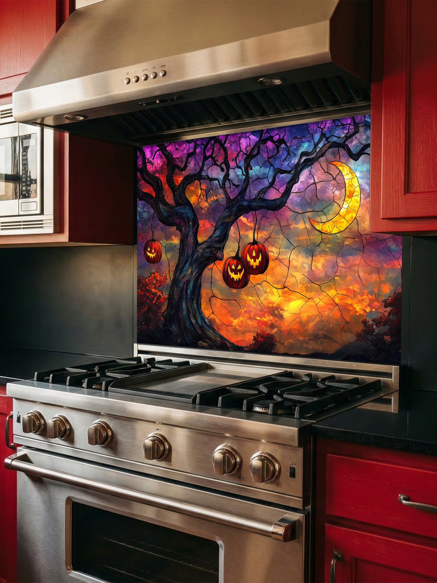 Stainless steel oven with a colorful Halloween-themed backsplash featuring pumpkins and a tree.