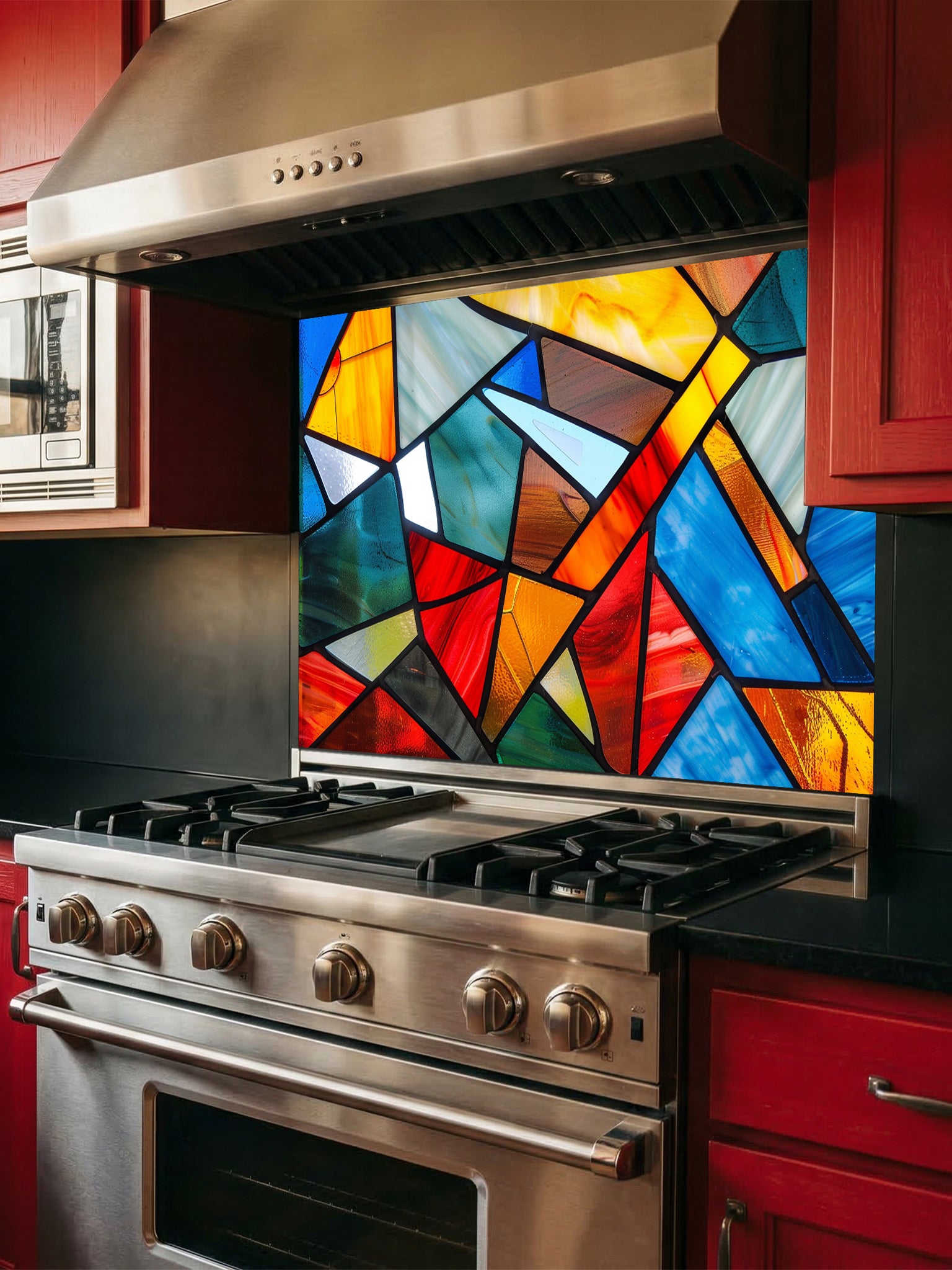 Tempered glass kitchen backsplash featuring a highly realistic illusion of abstract geometric stained glass with asymmetrical shards in vibrant, luminous shades of red, blue, yellow, and teal outlined by dark faux lead lines, installed behind a modern black stove.