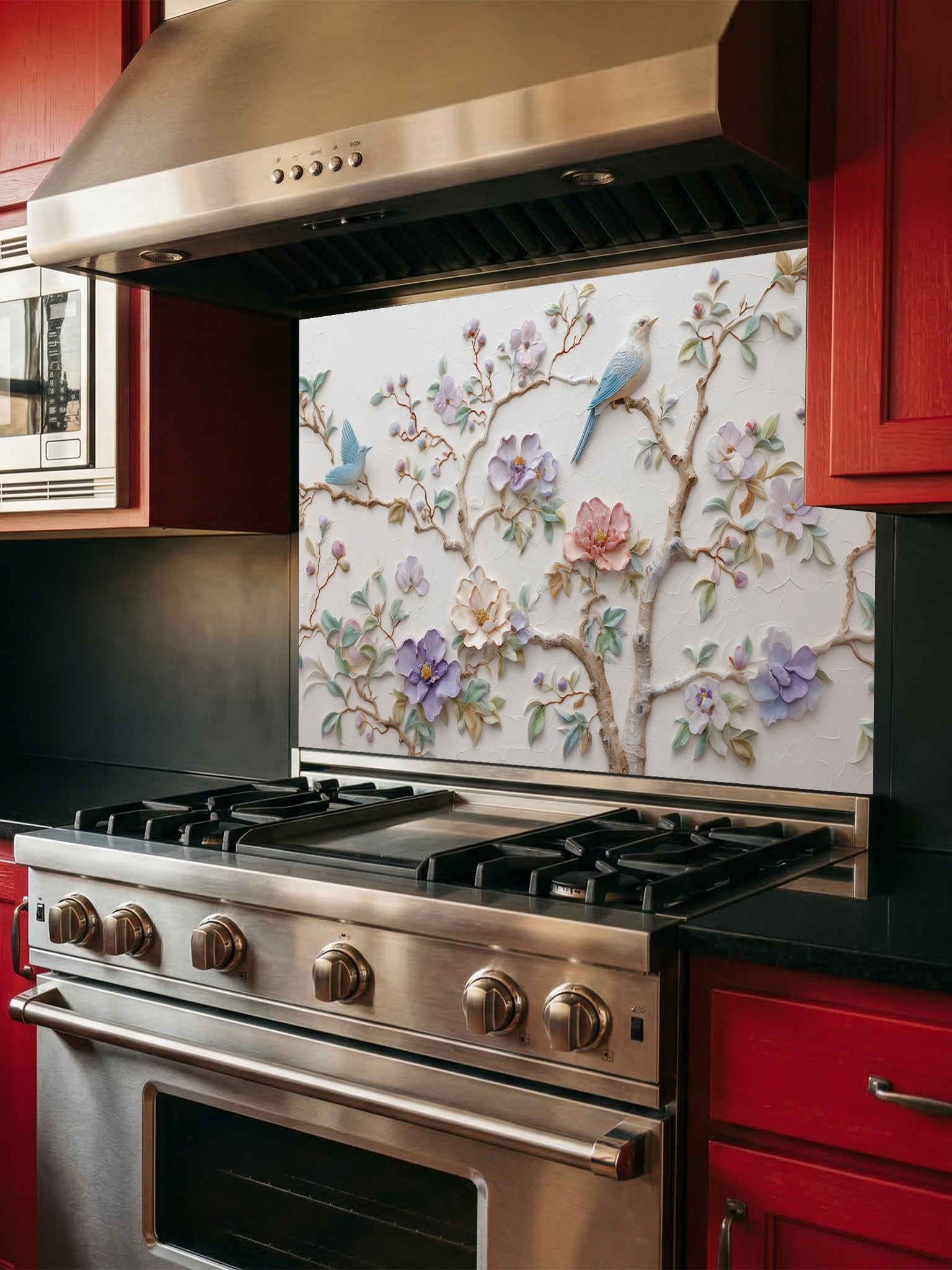Tempered glass kitchen backsplash featuring a highly realistic 3D illusion of bas-relief plaster art with pastel blooming flowers and light blue birds perched on branches against a white textured background, installed behind a modern stainless steel stove.