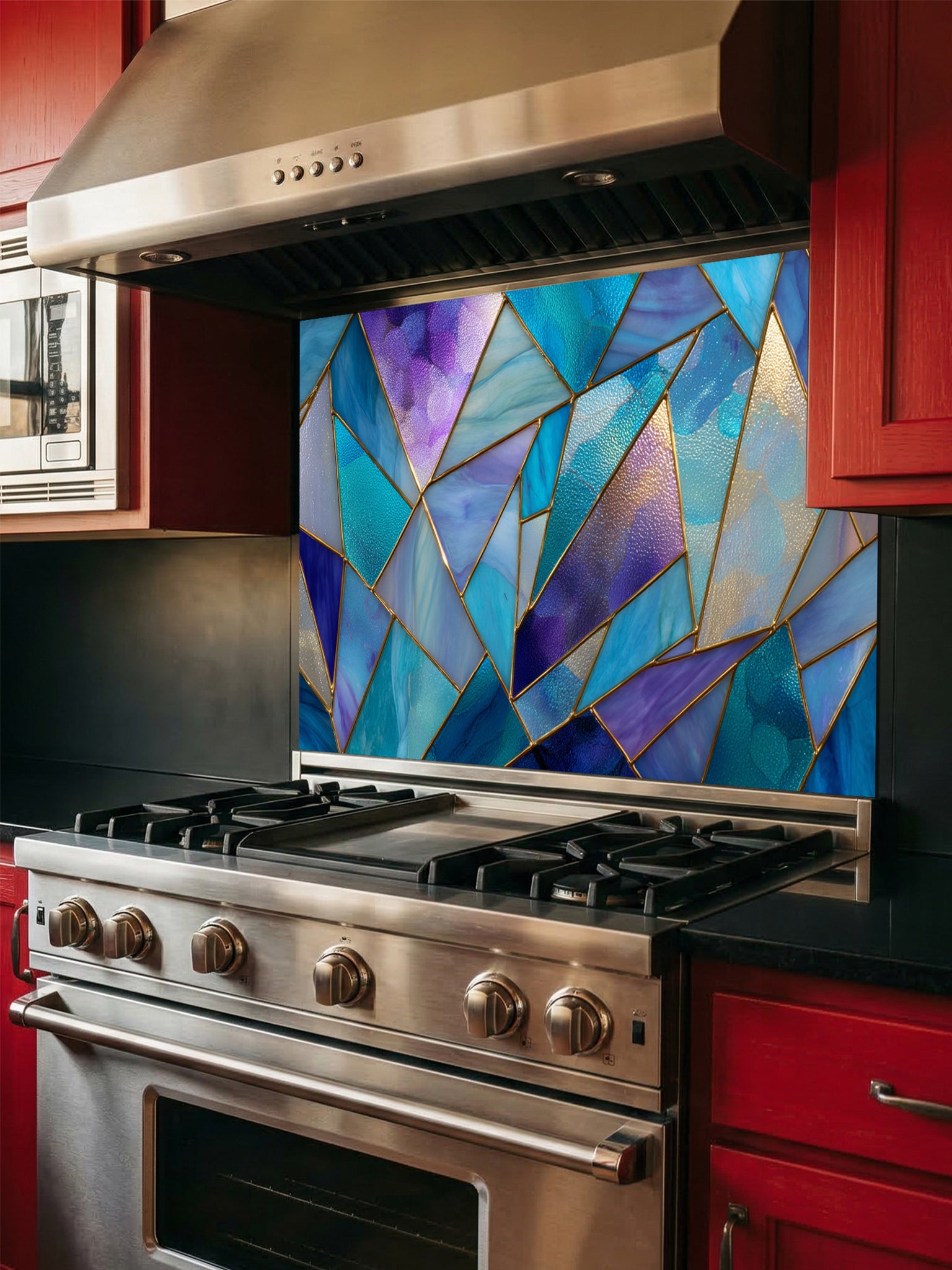 Tempered glass kitchen backsplash featuring a vibrant geometric stained glass effect with blue, teal, and purple shards separated by gold lines, installed behind a modern stainless steel stove.