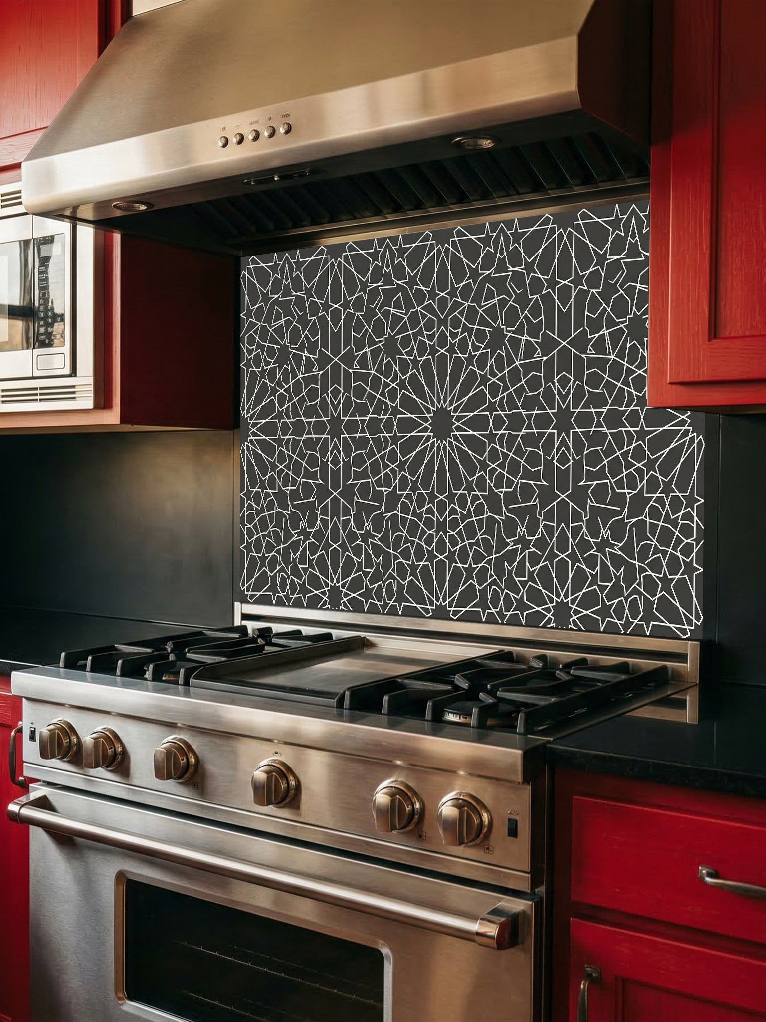 Stainless steel oven with geometric patterned backsplash in a kitchen setting.