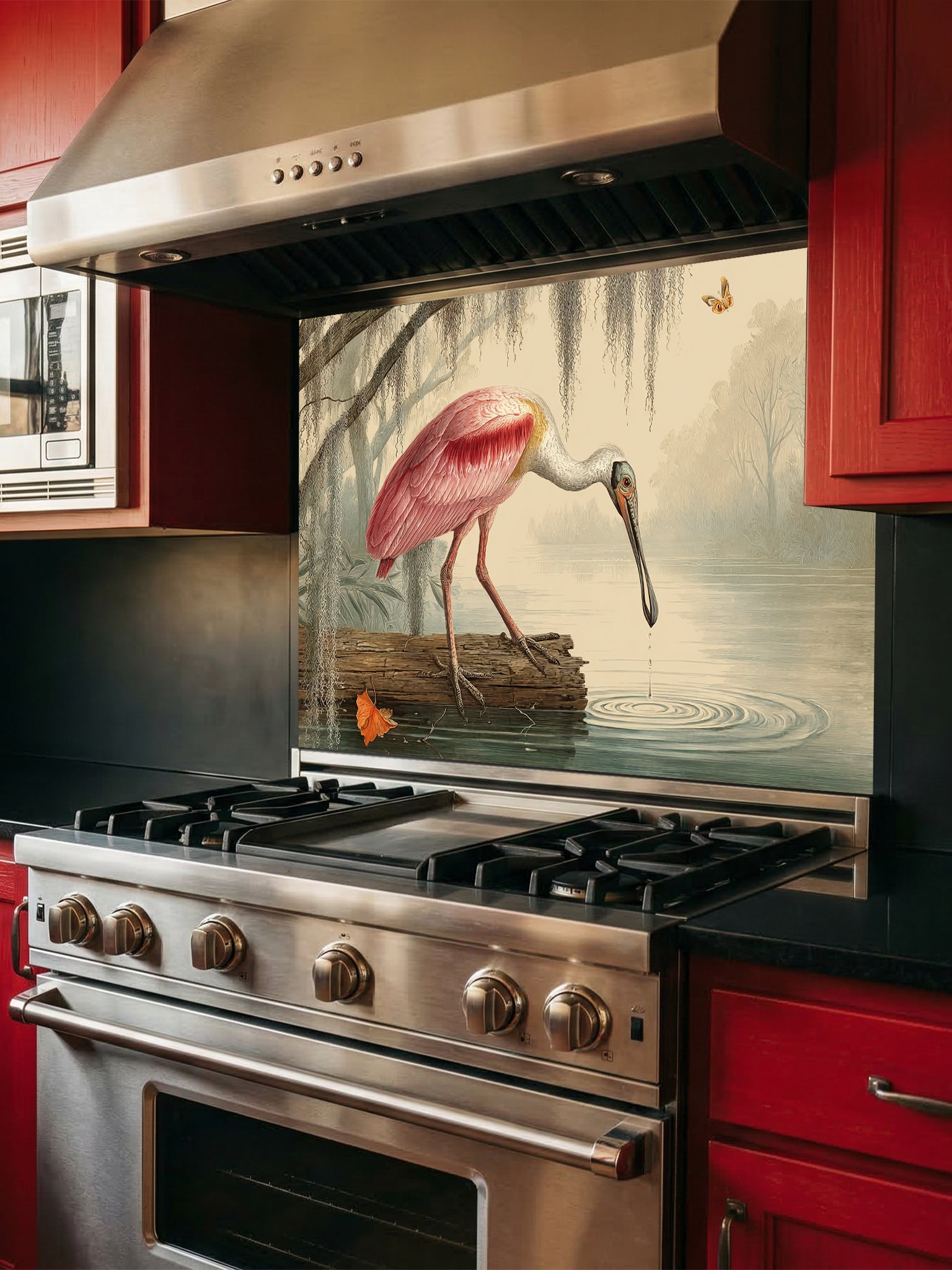 Tempered glass kitchen backsplash featuring a highly realistic illusion of a vintage Audubon-style naturalist illustration showing a beautiful pink roseate spoonbill bird wading in a swamp with weeping Spanish moss against an aged parchment background, installed behind a modern black stove.