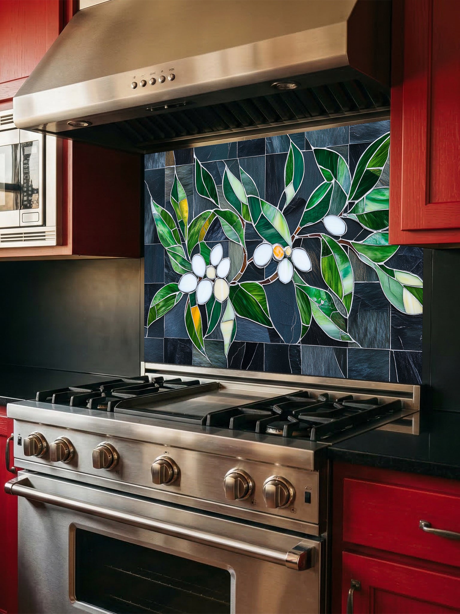 Tempered glass kitchen backsplash featuring a highly realistic 3D illusion of stained glass white blossoms and emerald green leaves integrated into a background of dark charcoal grey textured slate tiles, installed behind a modern black stove.